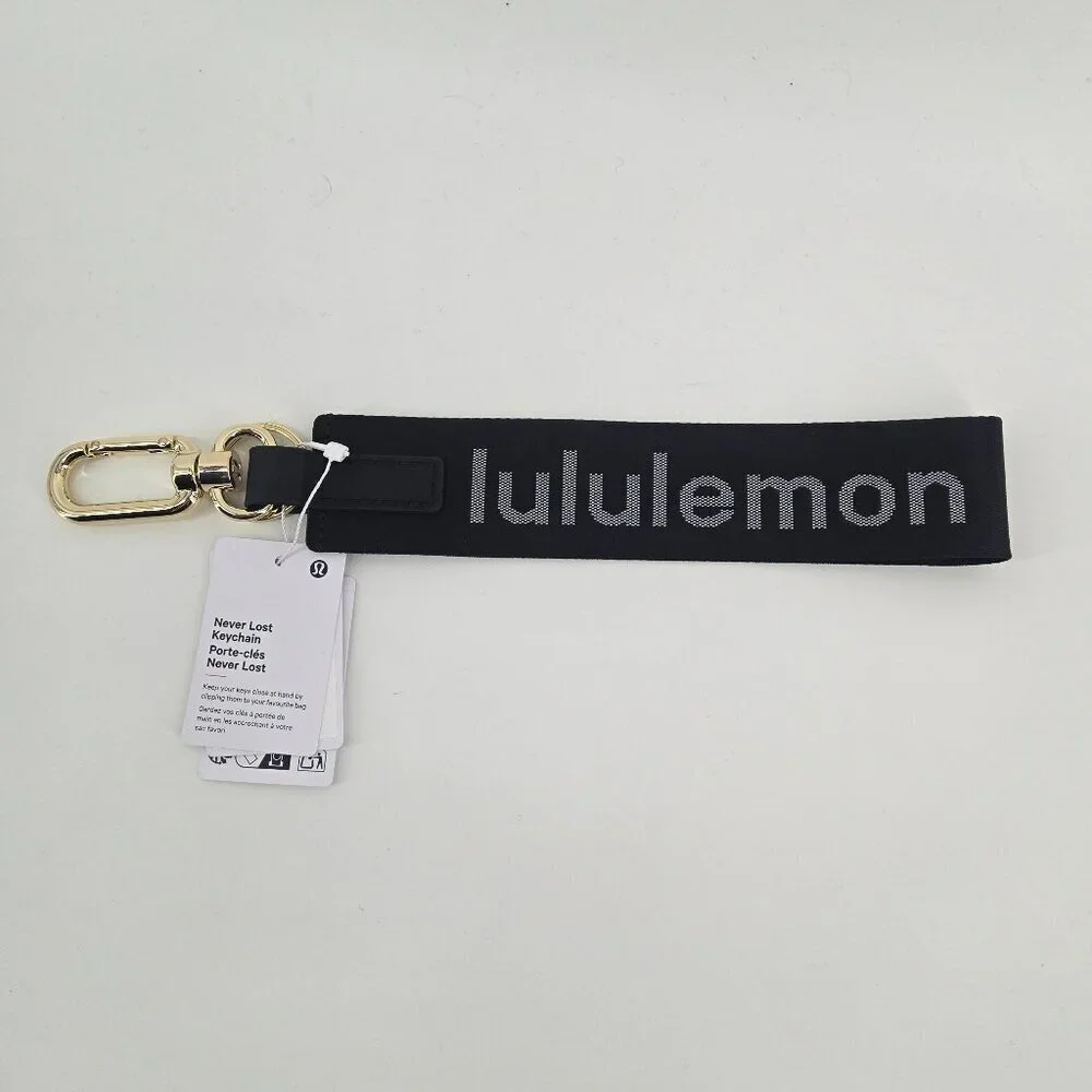 NWT Never Lost Keychain - Black/White/Gold